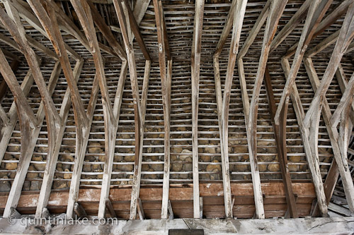 Interior View of Roof beams and stone tiling at Chipping Campden Market Hall, Gloucestershire