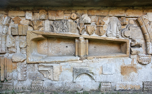 Churchyard Wall, North Side of Churchyard, Church of St Peter, Stanway, reused stone from church including stone coffin