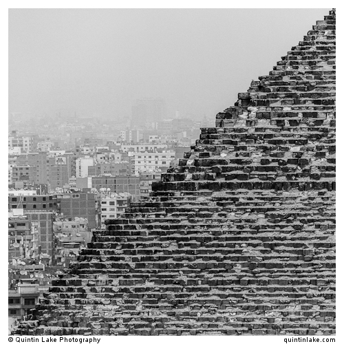 Great Pyramid of Giza in front of modern skyline of Cairo