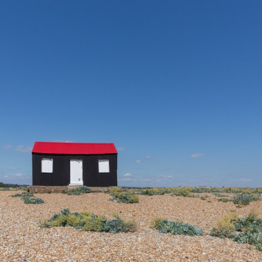 Beach hut with red roof, Rye Harbour, Sussex.