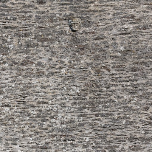 Limestone carved head on the tower of Church of St Mary, Sheviock, Cornwall.