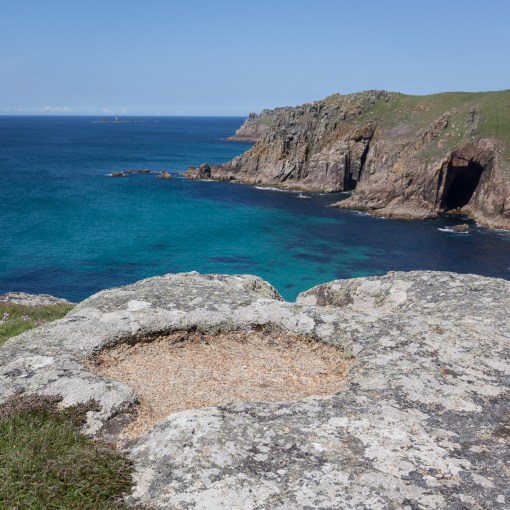 Carved bowls above Ardensawah cliff and Pendower Cove, Cornwall.