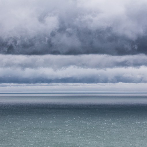 Banded clouds, glimpse of Wales from Somerset.