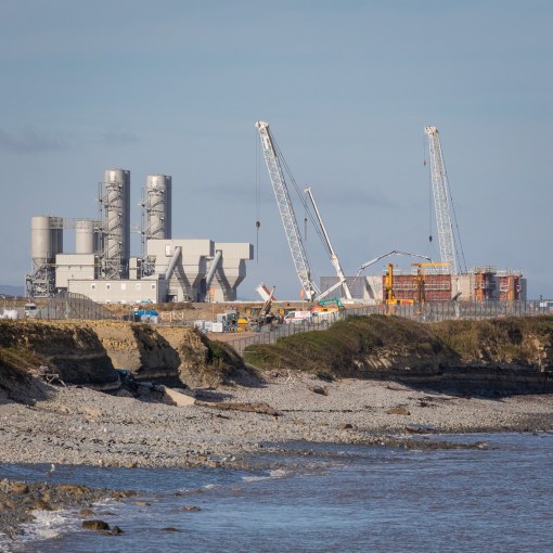 Hinkley Point C nuclear power station, construction site and cement silos, Somerset.