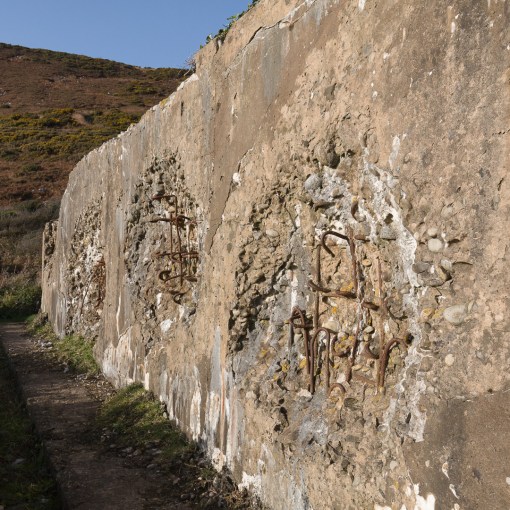 Shell damage to concrete block structure used in WW2 as preparation for Operation Neptune, the amphibious assault of mainland Western Europe. Ragwen Point near Pendine, Dyfed.