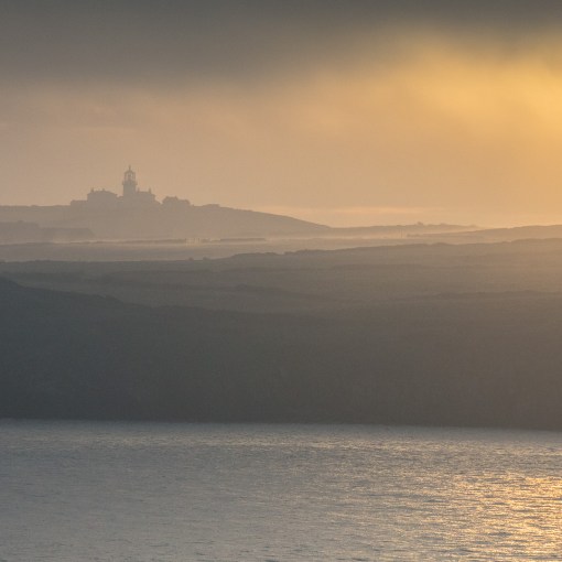 Sunrise over Caldey Island lighthouse, Dyfed.