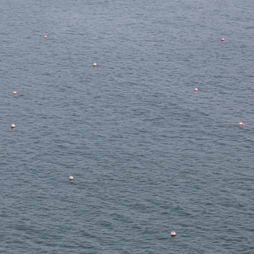 Constellation of net buoys, Lydstep Haven, Dyfed.