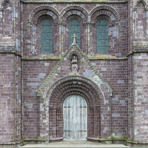 West front of St David’s Cathedral made of distinctive purple Cambrian sandstone, Pembrokeshire.